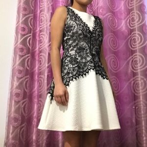 Ivory dress with black lace vest design